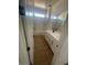 Main bathroom with double vanity, tub, and neutral color scheme at 19009 W Maryland Ave, Waddell, AZ 85355