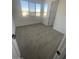 Bright bedroom with large windows and plush carpeting at 19009 W Maryland Ave, Waddell, AZ 85355