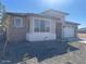 Single-story home with modern facade, attached garage, and landscaped front yard at 19009 W Maryland Ave, Waddell, AZ 85355