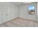 Simple bedroom with double doors and carpet flooring at 19339 W Valle Vista Way, Litchfield Park, AZ 85340