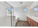 Elegant bathroom with a glass shower, soaking tub, and double vanity at 19436 W Valle Vista Way, Litchfield Park, AZ 85340