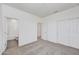 Well-lit bedroom featuring carpet floors and private bathroom access at 19436 W Valle Vista Way, Litchfield Park, AZ 85340