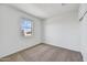 Spacious bedroom with neutral carpet and a window view at 19436 W Valle Vista Way, Litchfield Park, AZ 85340