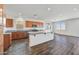 Modern kitchen with granite countertops and wooden cabinets at 19436 W Valle Vista Way, Litchfield Park, AZ 85340