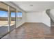 Spacious living room with tile floors and sliding glass doors at 19436 W Valle Vista Way, Litchfield Park, AZ 85340