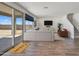 Bright and spacious living room with tile floors and sliding glass doors leading to backyard at 19436 W Valle Vista Way, Litchfield Park, AZ 85340