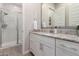 Modern bathroom with a walk-in shower and granite vanity at 19651 W Monterey Way, Buckeye, AZ 85396