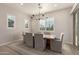 Bright dining room featuring a large wooden table and access to backyard at 19651 W Monterey Way, Buckeye, AZ 85396