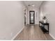 Bright and airy entryway with wood-look tile flooring and a view of a glass front door at 19651 W Monterey Way, Buckeye, AZ 85396