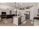 Modern kitchen with stainless steel appliances and granite island at 19651 W Monterey Way, Buckeye, AZ 85396