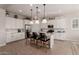 Modern kitchen with white shaker cabinets, granite countertops, and stainless steel appliances at 19651 W Monterey Way, Buckeye, AZ 85396