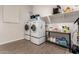 Laundry room with washer, dryer, and storage shelves at 19651 W Monterey Way, Buckeye, AZ 85396