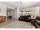 Open concept living room with a view of the kitchen and dining area at 19651 W Monterey Way, Buckeye, AZ 85396