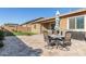 Patio with seating area, umbrella, and built-in BBQ at 19651 W Monterey Way, Buckeye, AZ 85396