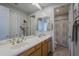 Double sink bathroom with shower and linen closet at 20802 N Grayhawk Dr # 1173, Scottsdale, AZ 85255