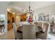 Elegant dining room features a large table and chandelier at 20802 N Grayhawk Dr # 1173, Scottsdale, AZ 85255