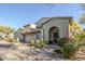 Two-story home with Spanish-style architecture, two-car garage, and landscaped front yard at 20802 N Grayhawk Dr # 1173, Scottsdale, AZ 85255