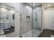 Large walk-in shower with patterned floor and glass enclosure at 20802 N Grayhawk Dr # 1173, Scottsdale, AZ 85255