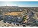 Aerial view of community, showing homes, park, and mountain views at 25536 S 230Th St, Queen Creek, AZ 85142