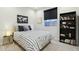 Cozy bedroom with a bookshelf and polka dot bedding at 25536 S 230Th St, Queen Creek, AZ 85142