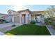 Single-story home with a two-car garage and landscaped front yard at 25536 S 230Th St, Queen Creek, AZ 85142