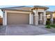 Single-story home with a two-car garage and landscaped front yard at 25536 S 230Th St, Queen Creek, AZ 85142