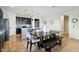 Modern kitchen with dark cabinets and an island at 25536 S 230Th St, Queen Creek, AZ 85142