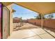 Covered patio area with small yard and string lights at 25875 W St Catherine Ave, Buckeye, AZ 85326