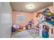 bedroom with playful unicorn mural and toys at 25875 W St Catherine Ave, Buckeye, AZ 85326