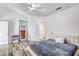 Main bedroom with gray bedding and ceiling fan at 25875 W St Catherine Ave, Buckeye, AZ 85326