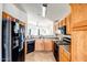 Kitchen boasts modern black appliances and ample counter space at 25875 W St Catherine Ave, Buckeye, AZ 85326