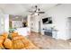 Living room features a flat-screen TV and a modern fireplace at 25875 W St Catherine Ave, Buckeye, AZ 85326