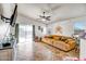 Living room with large sectional sofa and sliding glass doors at 25875 W St Catherine Ave, Buckeye, AZ 85326