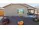 Landscaped backyard with fire pit and gravel at 25940 W Oraibi Dr, Buckeye, AZ 85396