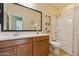 Bathroom with single vanity, tub, and shower at 25940 W Oraibi Dr, Buckeye, AZ 85396