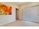 Bedroom with large closet and floral wall art at 25940 W Oraibi Dr, Buckeye, AZ 85396