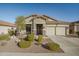 Single-story home with landscaped yard and two-car garage at 25940 W Oraibi Dr, Buckeye, AZ 85396