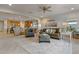 Comfortable living room featuring a sofa, armchairs, and an open floor plan at 25940 W Oraibi Dr, Buckeye, AZ 85396