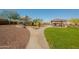 Community playground with play structures and shaded seating at 25940 W Oraibi Dr, Buckeye, AZ 85396