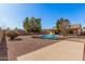 Spacious backyard with a sparkling pool and desert landscaping at 2605 S 80Th Ave, Phoenix, AZ 85043