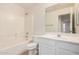 Clean bathroom, white vanity, and a shower/tub combo at 2605 S 80Th Ave, Phoenix, AZ 85043