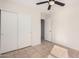 Bright bedroom with tiled floors and double door closet at 2605 S 80Th Ave, Phoenix, AZ 85043