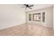 Spacious bedroom with bay window, ceiling fan, and tile floors at 2605 S 80Th Ave, Phoenix, AZ 85043