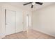 Bright bedroom with tiled floors and double door closet at 2605 S 80Th Ave, Phoenix, AZ 85043