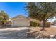 Single-story home with attached garage and well-manicured landscaping at 2605 S 80Th Ave, Phoenix, AZ 85043