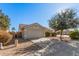 House exterior showcasing a two-car garage and front yard at 2605 S 80Th Ave, Phoenix, AZ 85043