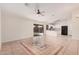 Open living space with tile flooring and kitchen view at 2605 S 80Th Ave, Phoenix, AZ 85043