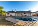 Backyard view showcasing the home's exterior and sparkling pool at 2618 W Surrey Ave, Phoenix, AZ 85029