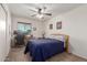 Bedroom with ceiling fan and window coverings at 2618 W Surrey Ave, Phoenix, AZ 85029