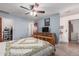 Bright bedroom with a ceiling fan and ample closet space at 2618 W Surrey Ave, Phoenix, AZ 85029